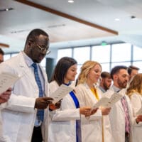 Class of 2026 reciting KYCO's professional conduct pledge